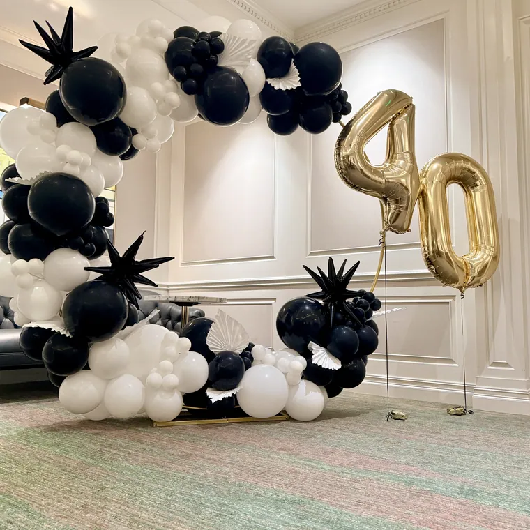 Black, white and gold balloon installation with a large gold foil 40.